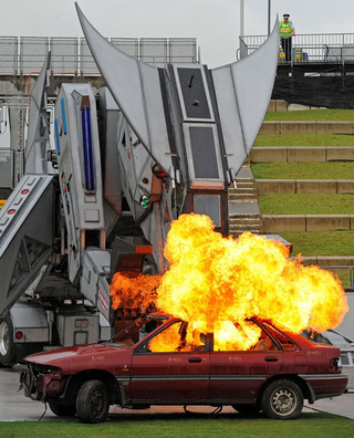 Illustration for article titled Robosaurus Devours A Creme-Filled Car: Time-Lapse Gallery